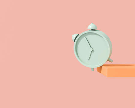A green classic alarm clock brightly lit by the sun's rays falls from a shelf on a pink background....