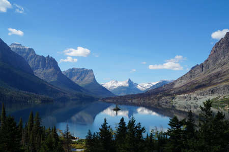 Lake with a small island in Glacier National Parkの写真素材