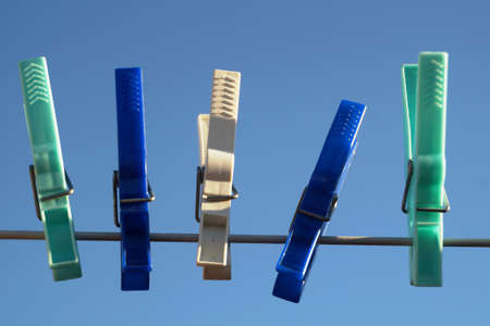 Clothespins on a clotheslineの写真素材