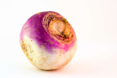 Yellow, white and purple turnip on a white background. Selective focus