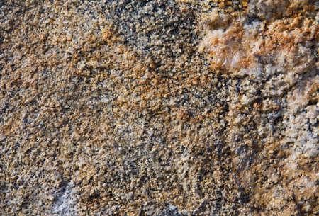 Orange, yellow, red stone textured granulated background, closeup, grossの写真素材
