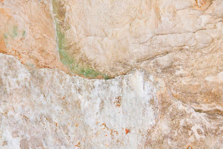 Green, red, yellow, white, creme, beige, light stone textured background with lines and curves, waved, closeup, abstractの写真素材