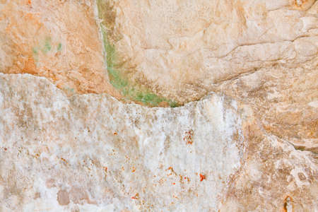 Green, red, yellow, white, creme, beige, light stone textured background with lines and curves, waved, closeup, abstractの写真素材