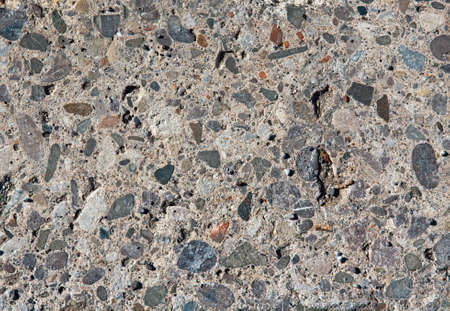 Black, yellow, red, blue stones and pebbles on a light backgroundの写真素材