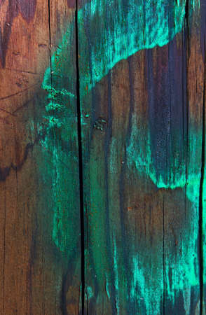 Old wooden green, red and brown plank texture backgroundの写真素材
