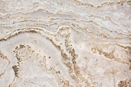 Yellow, white, creme, beige, light stone and sand textured background with lines and curves, closeupの写真素材