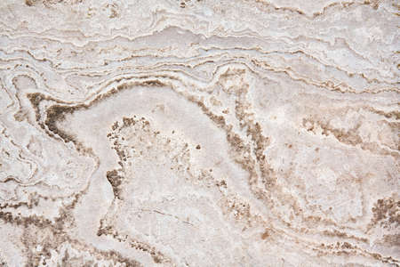 Yellow, white, creme, beige, light stone and sand textured background with lines and curves, closeupの写真素材