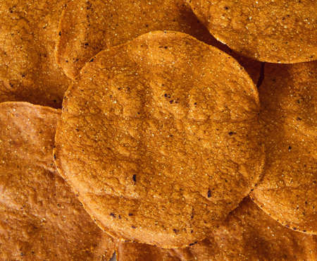 Round tostada taco yellow, background, textureの写真素材