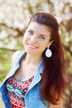 Closeup portrait of smiling beautiful sexy Caucasian adult girl woman with long dark red brown hair...