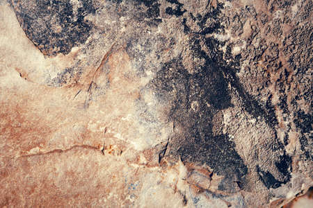 Yellow, red, green, gray, dark stone textured background with honeycombs, holes, lines and curves,...