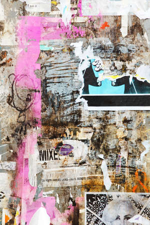 closeup of old aged news board advertising pin board for commercials with pieces of old aged torn white paperの写真素材