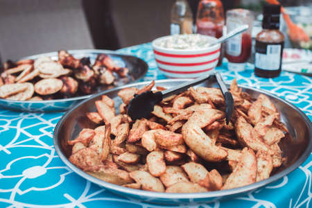 Dish with freshly cooked home french fries potato on table, toned with filtersの写真素材