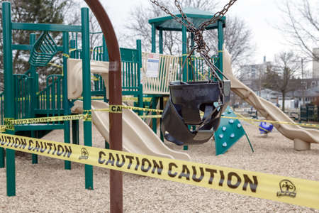 Toronto, Ontario, Canada - March 26, 2020: Closed outdoor playground. Kids play area locked with...
