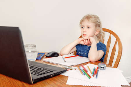 Girl child learning art lesson online on laptop Internet. Virtual drawing painting class on video...