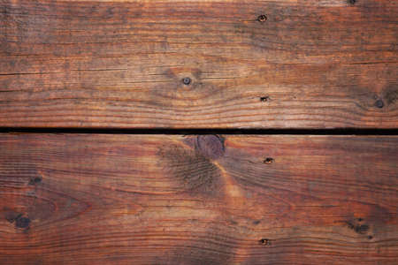 Closeup macro of wooden planks surface. Abstract natural red brown wooden texture background...