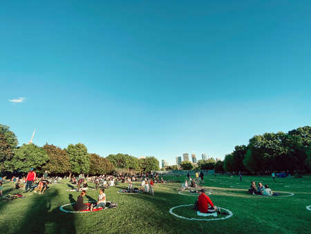 Toronto, Ontario, Canada - June 12, 2020: People sitting in painted circles in Trinity Bellwoods...