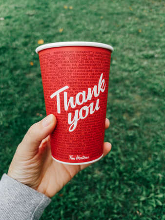 Toronto, Ontario, Canada - September 12, 2020: Thank you phrase on coffee cup from Canadian Tim Hortons restaurant chain. Thanks for frontline health care workers at covid-19 pandemic.のeditorial素材