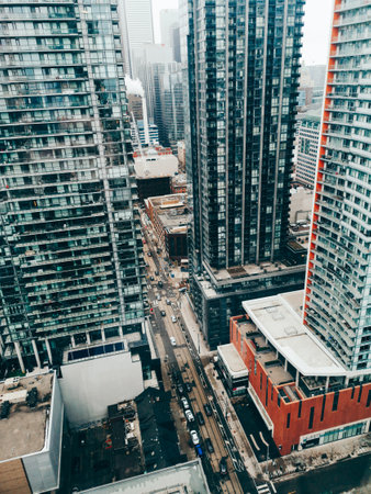 View on downtown Toronto city in Canada, Ontario from top above roof. Aerial urban view from high. Busy urban city street. Urban town city landscape cityscape with skyscrapers buildings.のeditorial素材