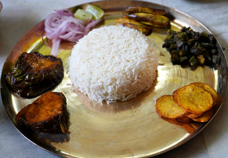 Bengal Thali with some vegetable fry served in metal plateの写真素材