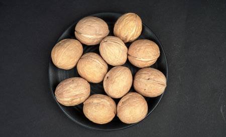 Top view of walnut in black backgroundの写真素材