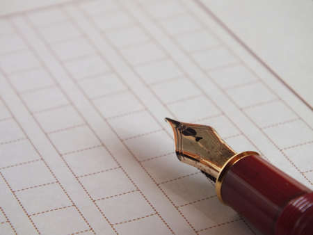 fountain pen on a paperの写真素材