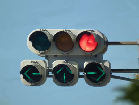  a red signal with three arrowsの写真素材