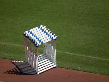 piled hurdles in a field and track eventsの写真素材