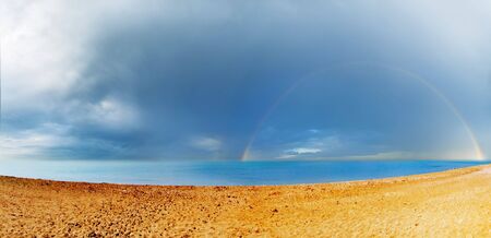 rainbow on a seaの写真素材