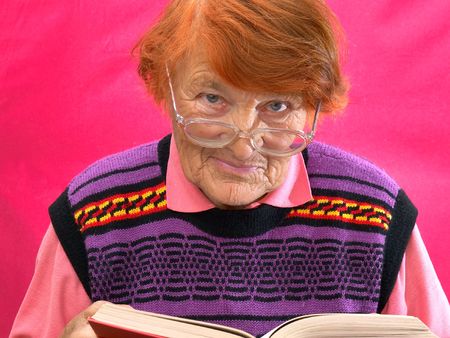 In a photo it is shown as the grandmother reads the bookの写真素材