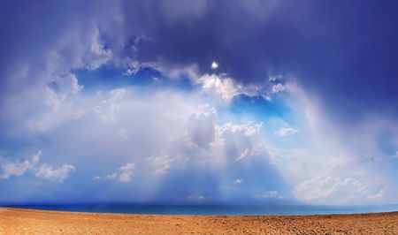 Beautiful sea landscape. Through clouds on the sea solar beams fall.の写真素材