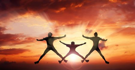 jump three mens(XXX) above the sun on a background of red cloudsの写真素材
