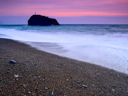 sunset on a background of the storm seaの写真素材