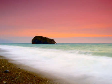 sunset on a background of the storm seaの写真素材