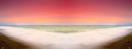 sunset on a background of the storm seaの写真素材