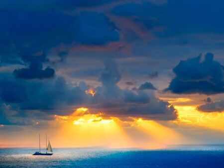 Through clouds on the sea light flows の写真素材