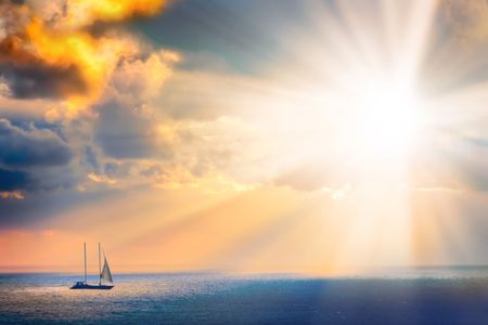 Through clouds on the sea light flows の写真素材