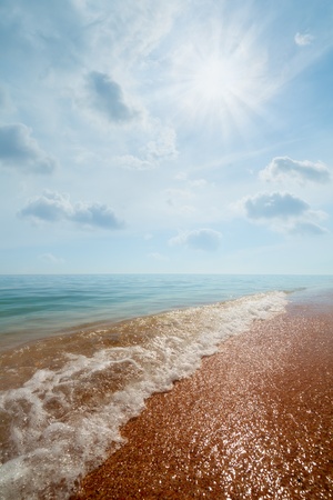 Beach and sea on the clouds backgroundの写真素材