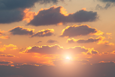 red sunset with clouds photographed by a telephoto lensの写真素材