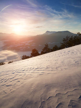 Winter scenery with mountains and a clouds.の写真素材