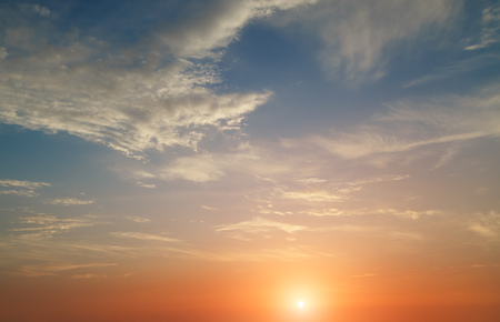 red sunset with clouds photographed by a telephoto lensの写真素材