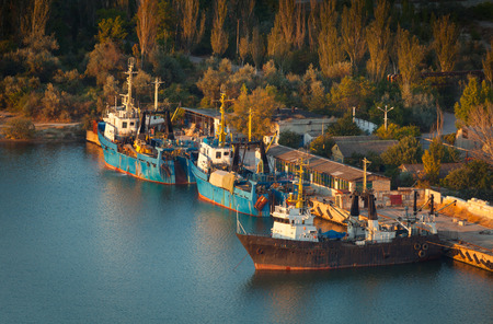 Rusty ships on the sea near the coast.の写真素材