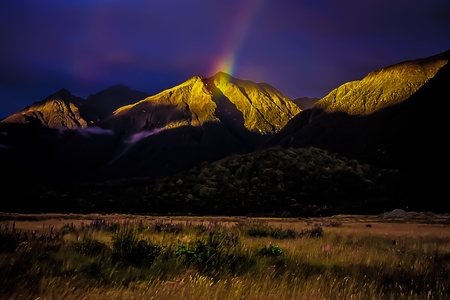 Rainbow at the Sunset in Mountain Landscape - Fiordland National Park - New Zealandの写真素材