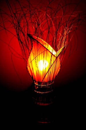 Creative lamp looking a flower ligths up the room with hot colorsの写真素材