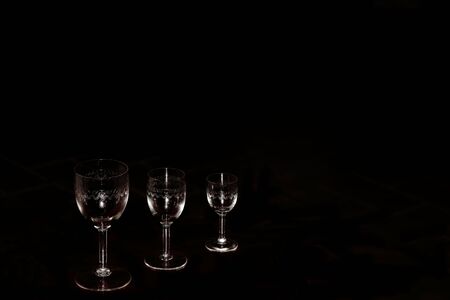 Three different size glasses in the black backgroundの写真素材