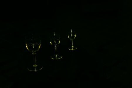 Three different size glasses in the black backgroundの写真素材