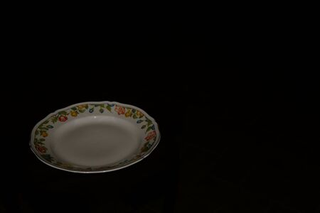 Ceramic plate hand painted in flowery styleの写真素材