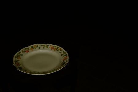 Ceramic plate hand painted in flowery styleの写真素材