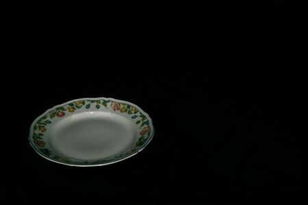 Ceramic plate hand painted in flowery styleの写真素材