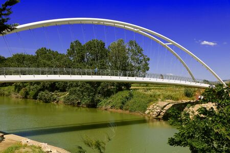 Getting out lockdown - People cycling across a bridge on a bicycle path in Spring - Maremma Regional Park - Tuscany - Italyの写真素材