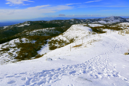View of hills covered with snow surrounding Monte Labbro - Grosseto - Tuscany - Italyの写真素材